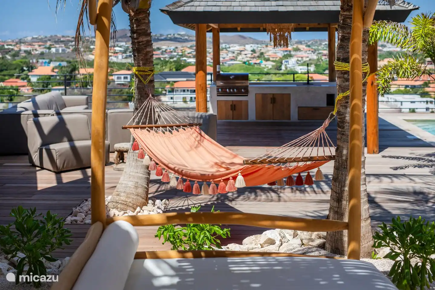 Doze off in the hammock between the palm trees!