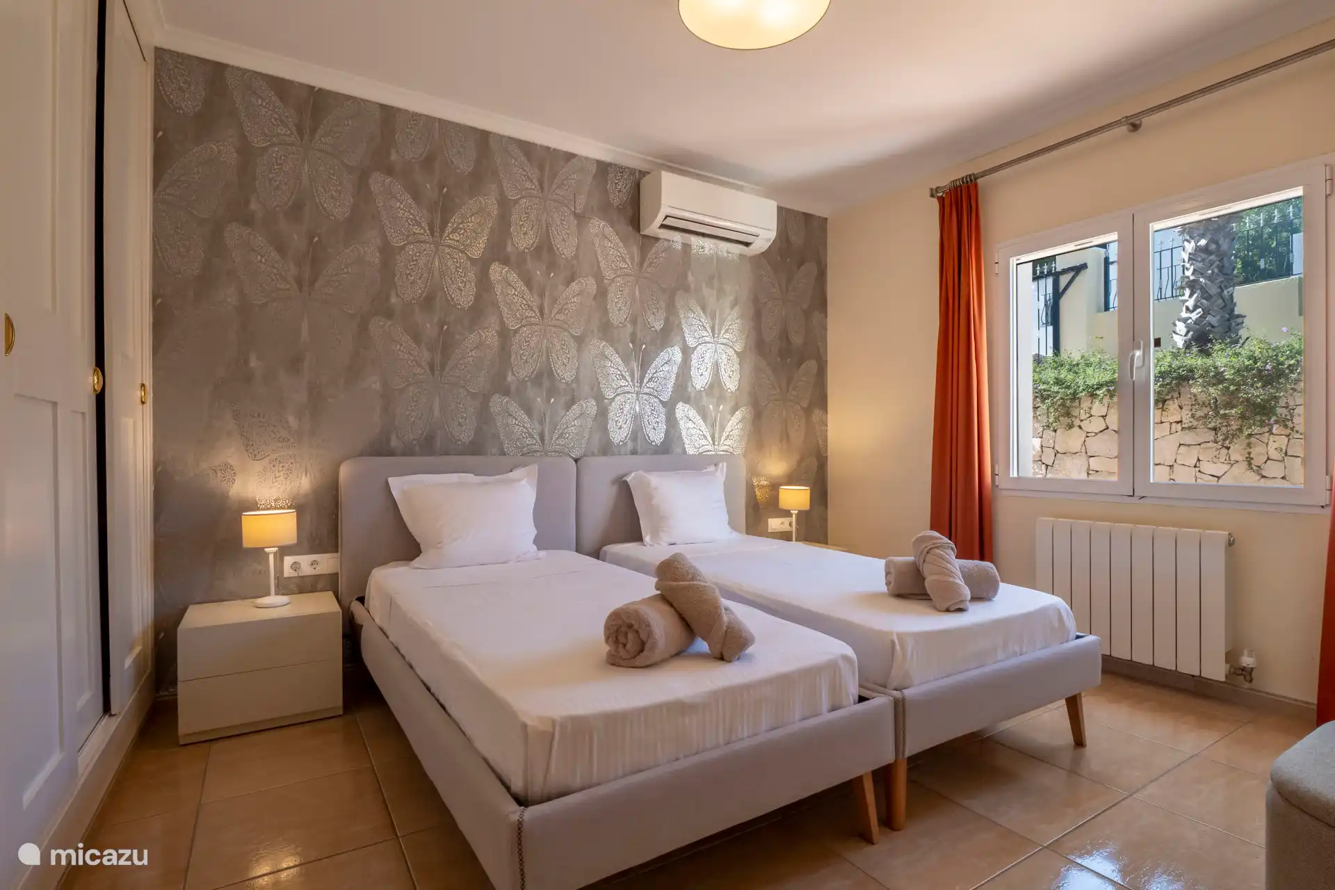 Bedroom 2 with good beds and air conditioning.