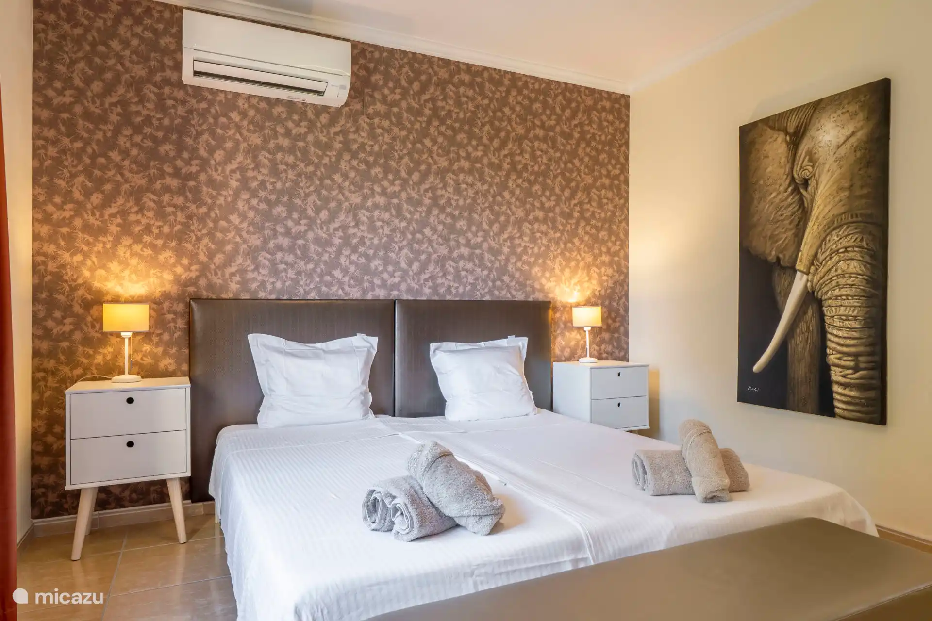 Bedroom 1, also with air conditioning.