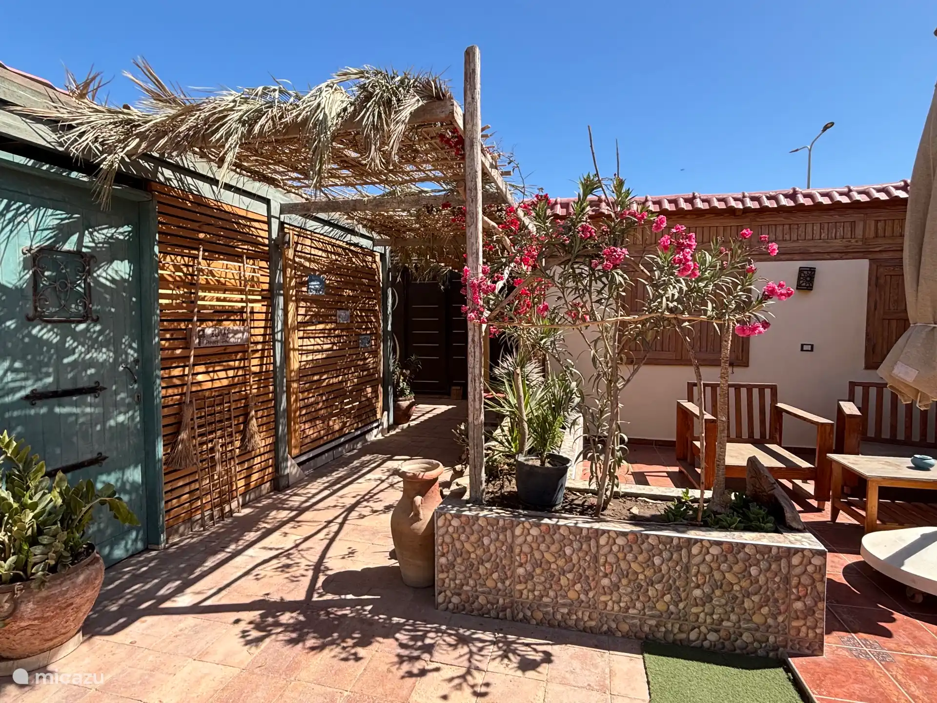 Piece of terrace and entrance to the gate