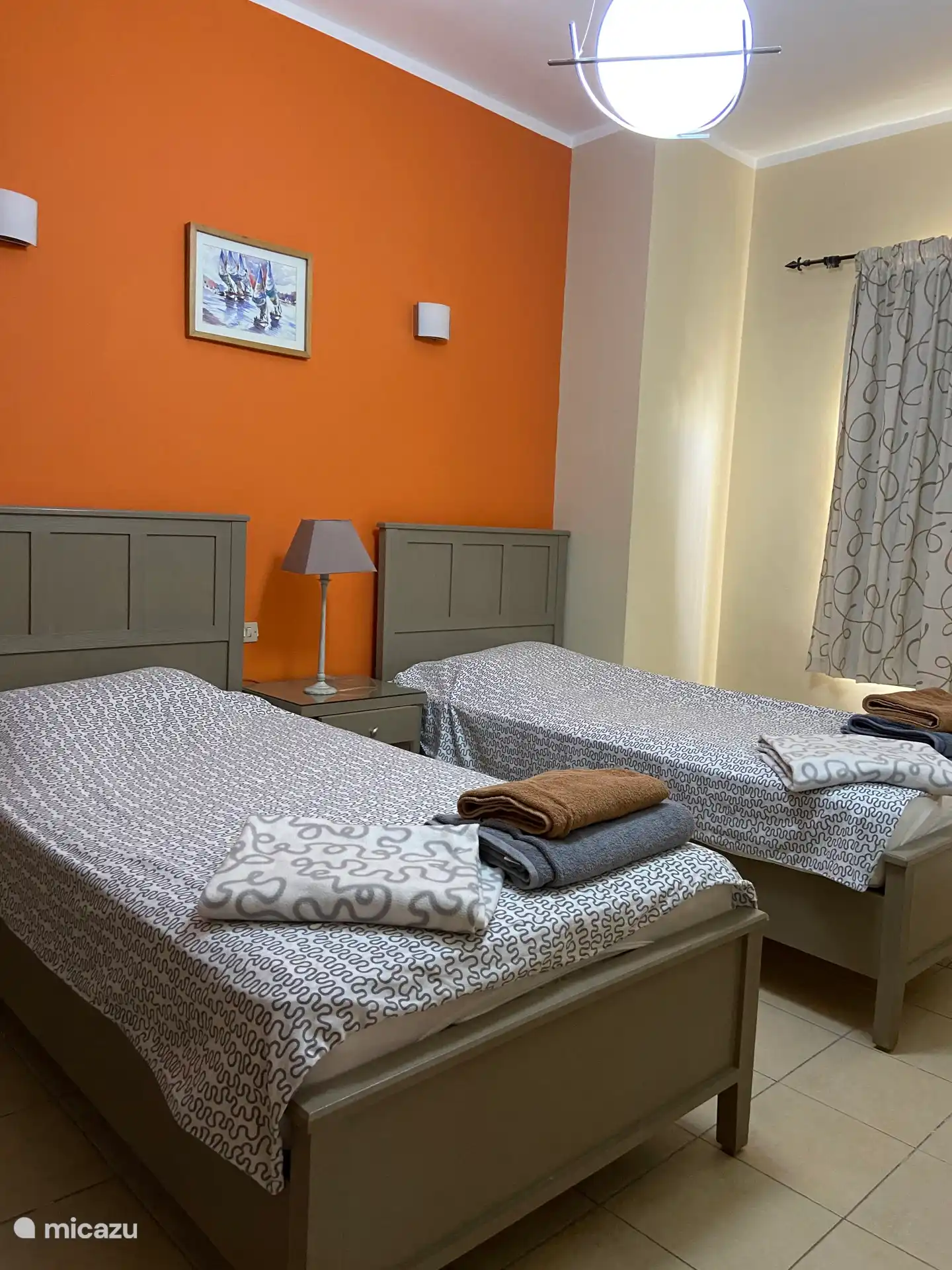 rear bedroom with air conditioning and windows