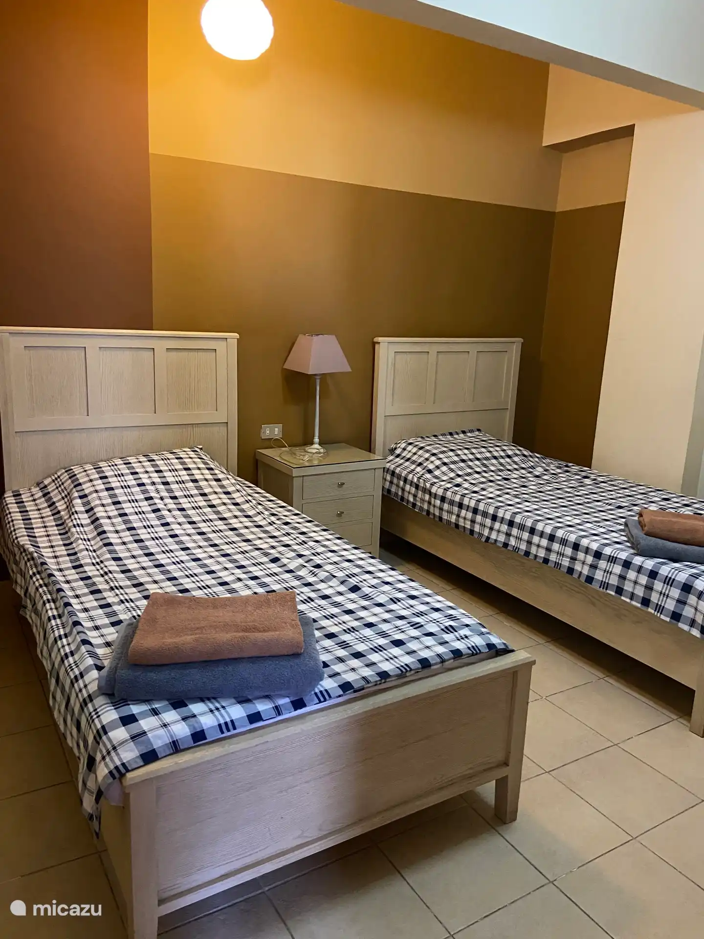 bedroom in the middle without windows air conditioning but with a fan