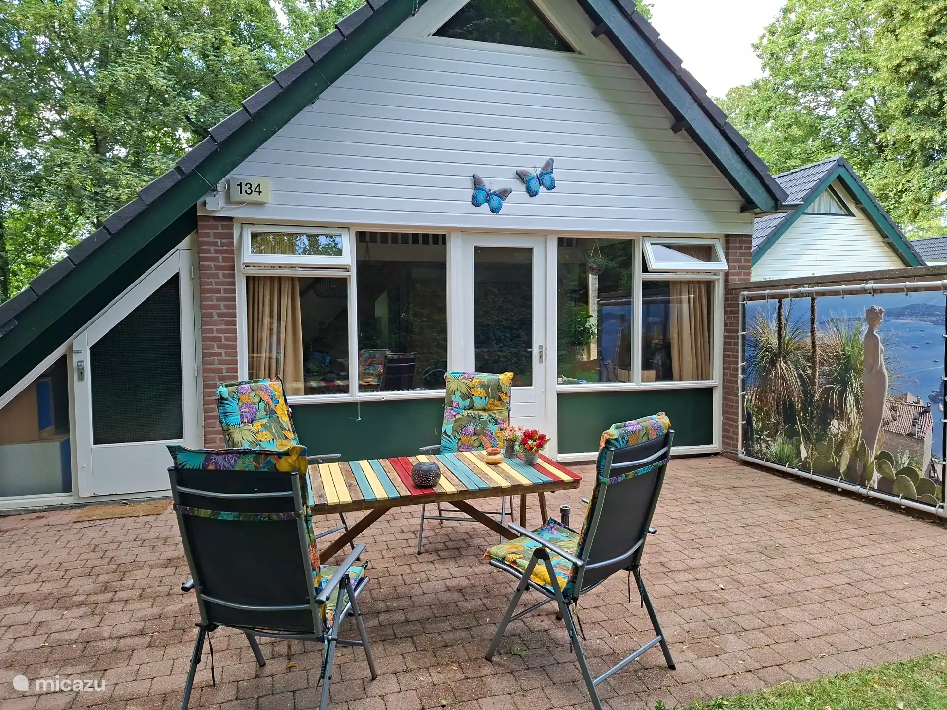 Terrace at the front; Garden furniture with fine cushions and a parasol is available