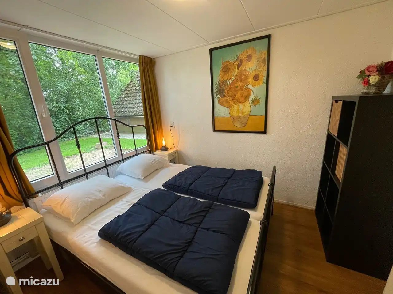 Downstairs bedroom with double bed and storage space for clothes