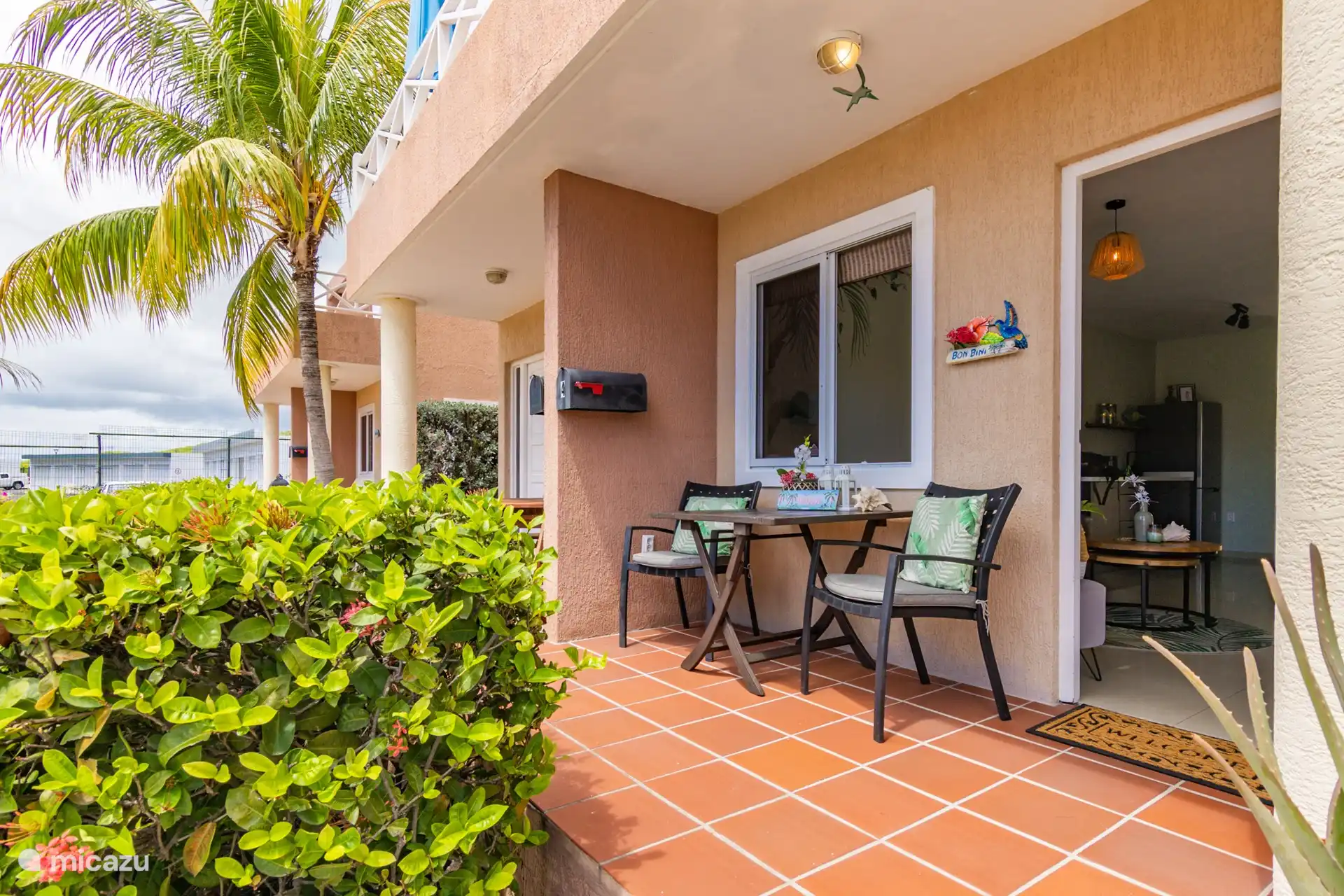 Front with a lovely seat with a cup of coffee or a nice breakfast