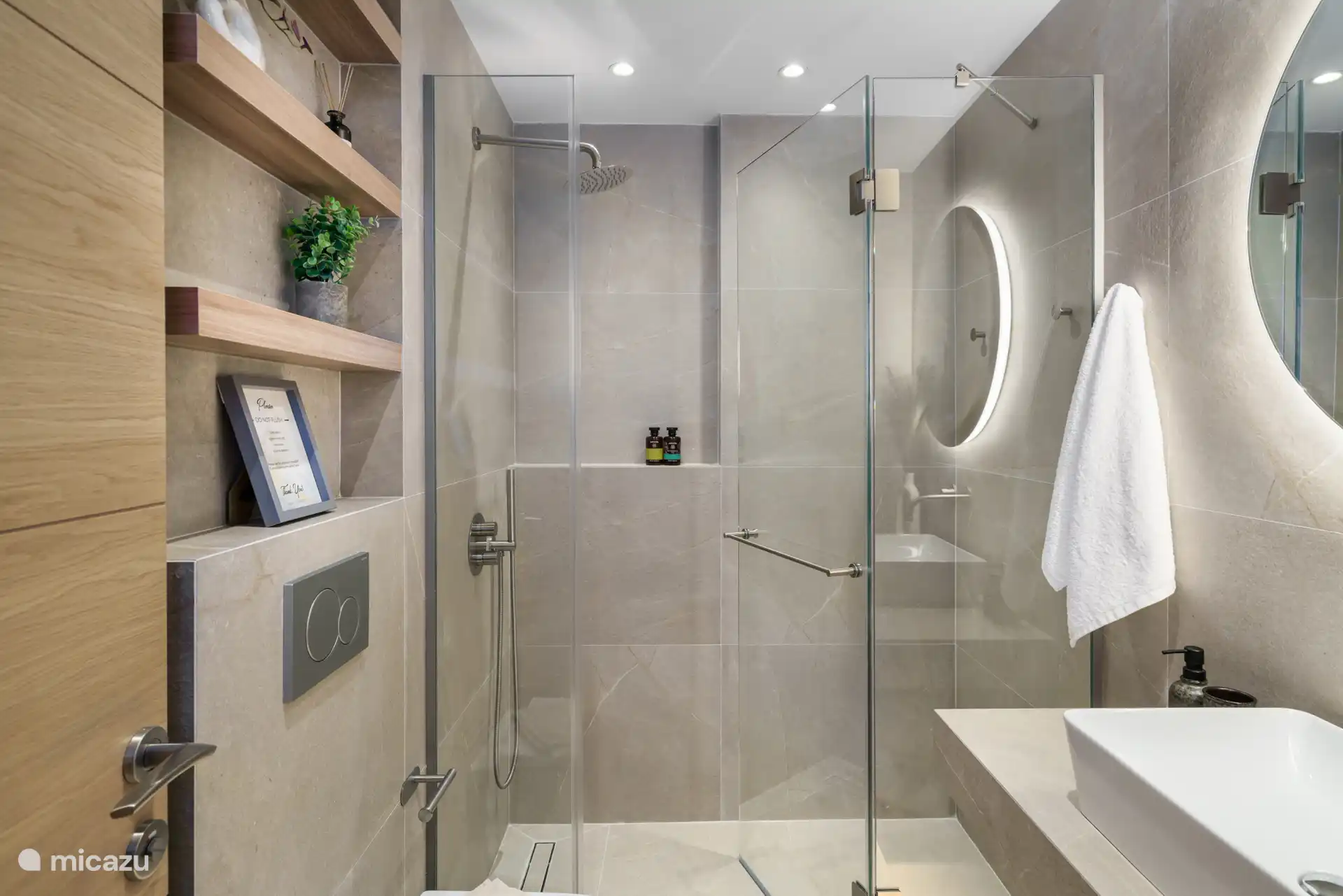 Upstairs bathroom with walk-in shower, toilet, dryer and washing machine