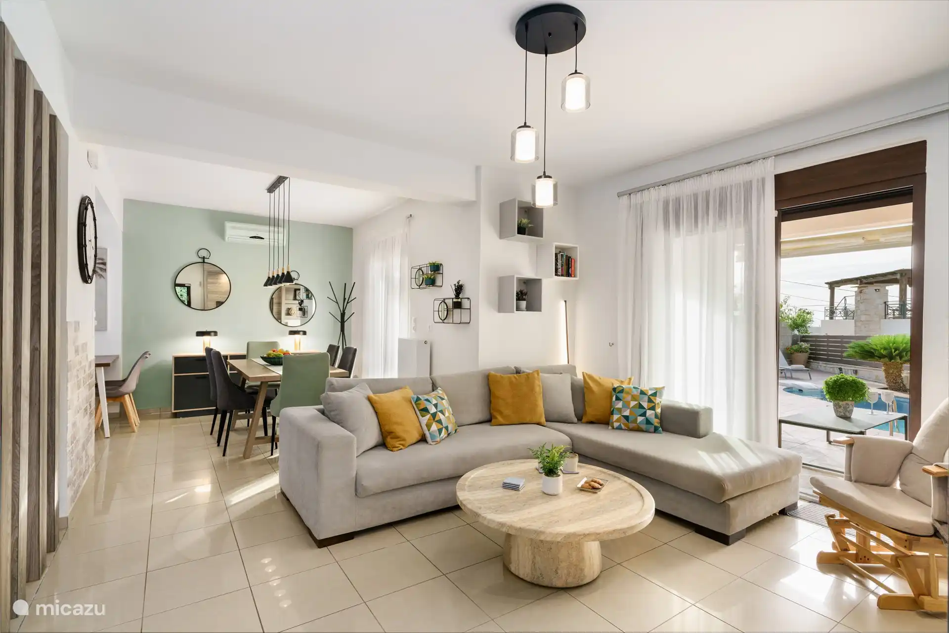 Living room and access to outdoor lounge area