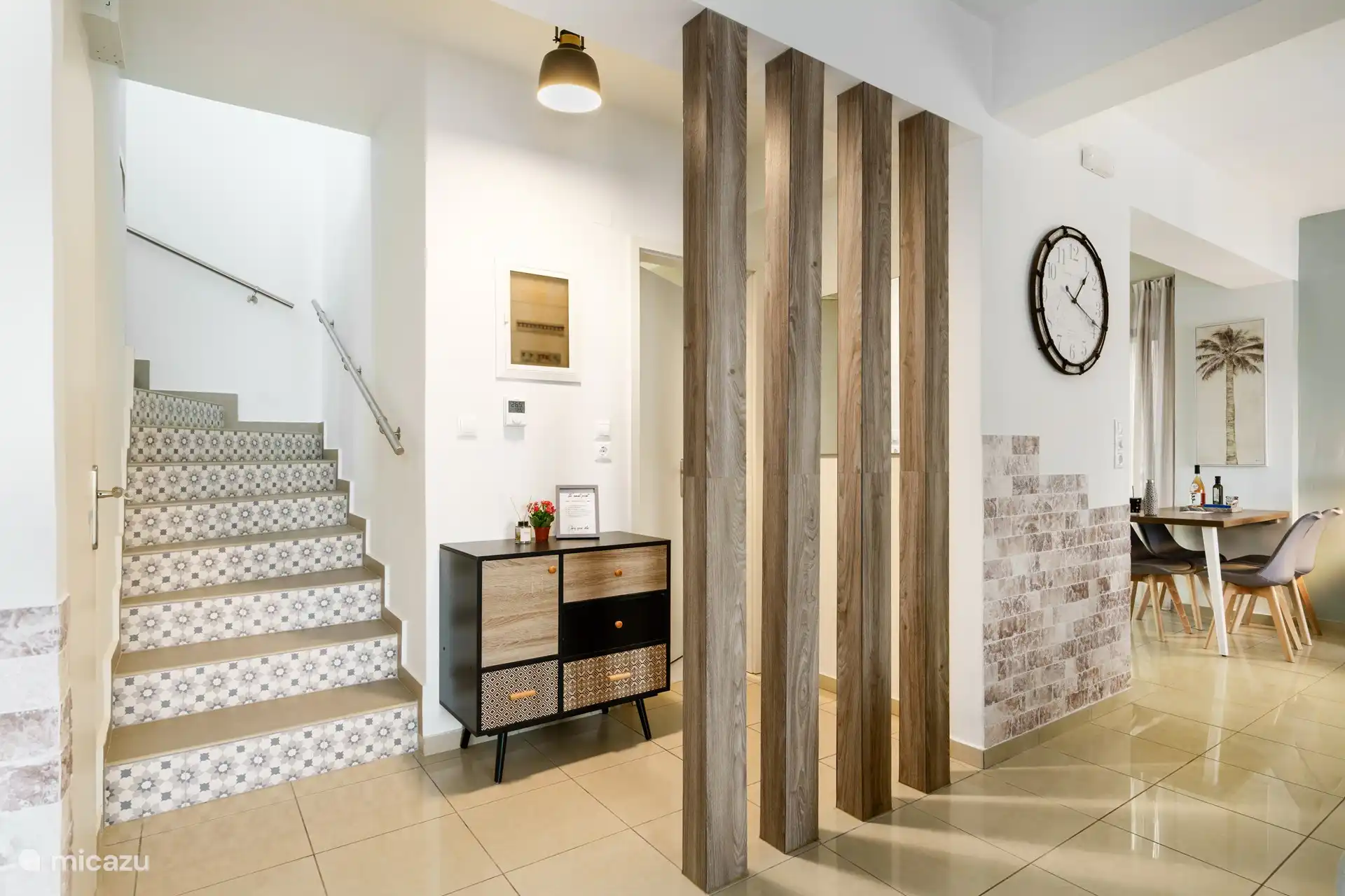Downstairs bathroom and stairs to upper level bedrooms and bathroom