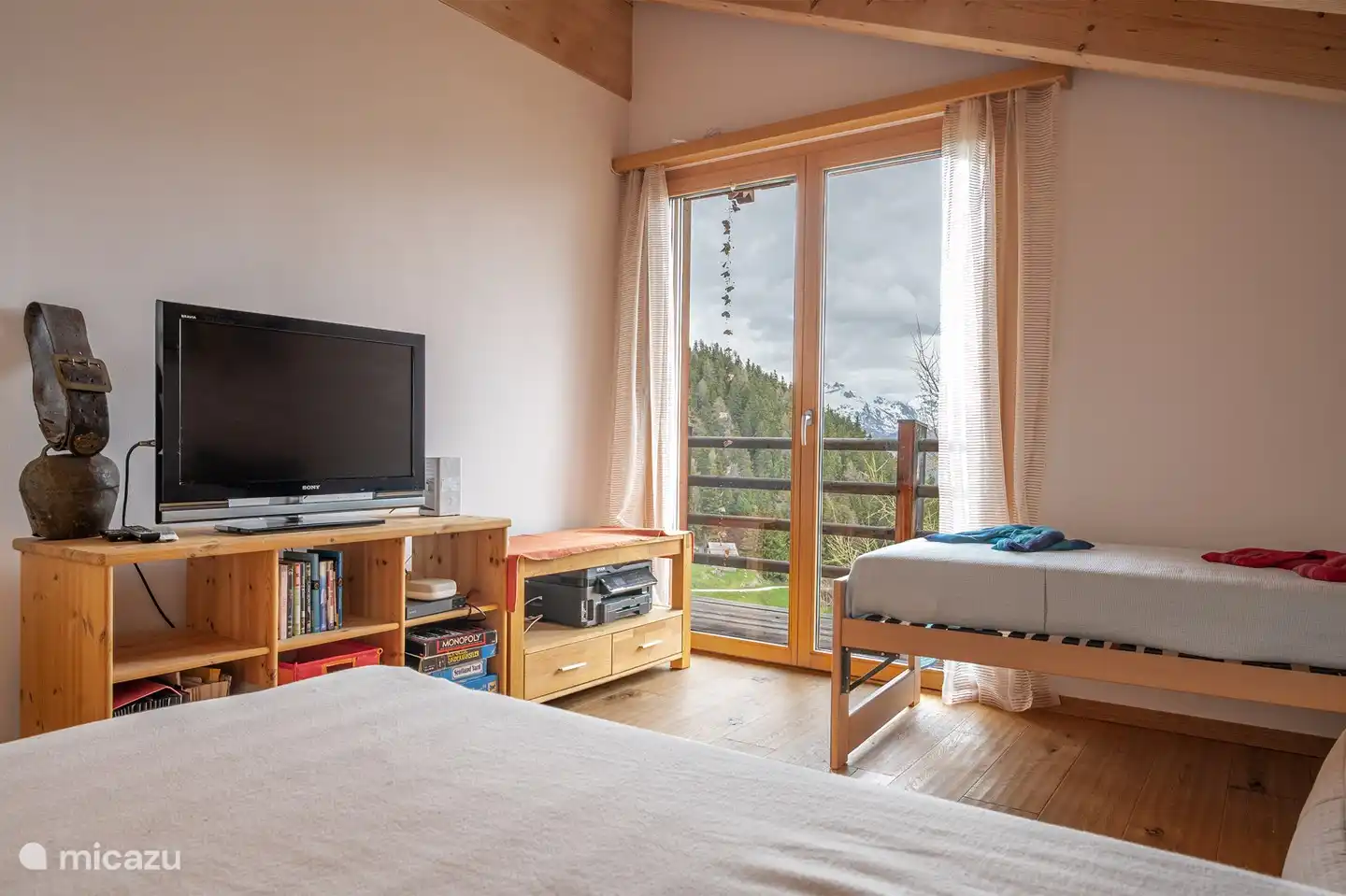 1 TV room with 2 additional single beds, no TV in the living area.