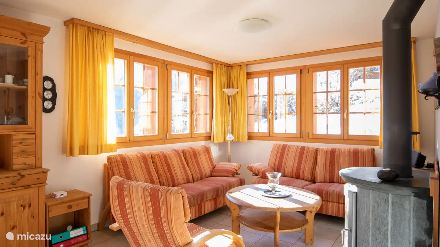 The middle floor features a large, beautifully furnished living room with a spacious dining area and open plan kitchen