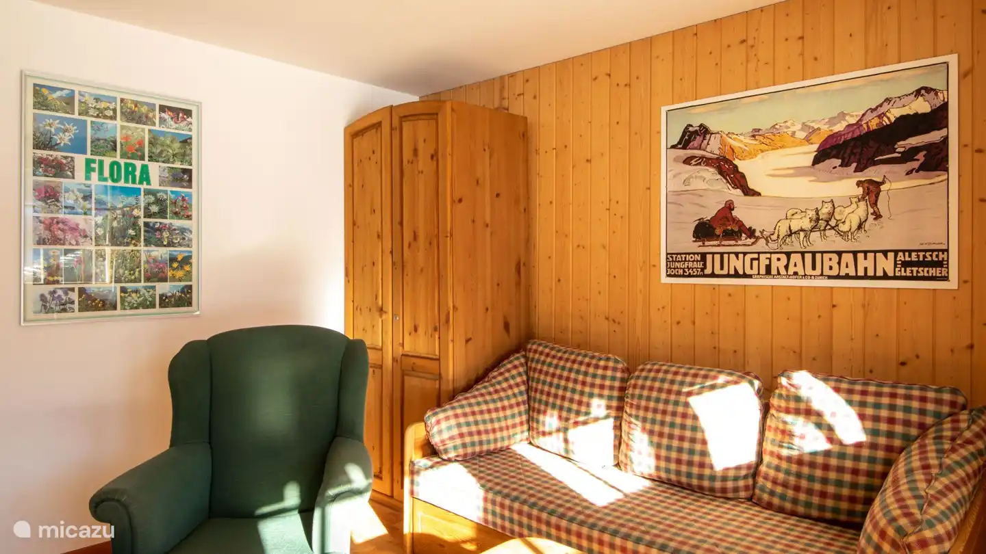 The ground floor has a second living room with a television