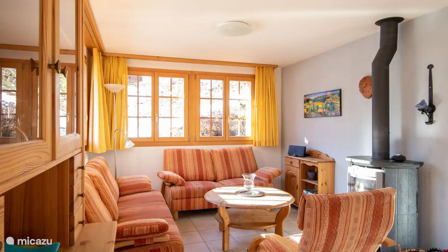 The middle floor features a large, beautifully furnished living room with a spacious dining area and open plan kitchen