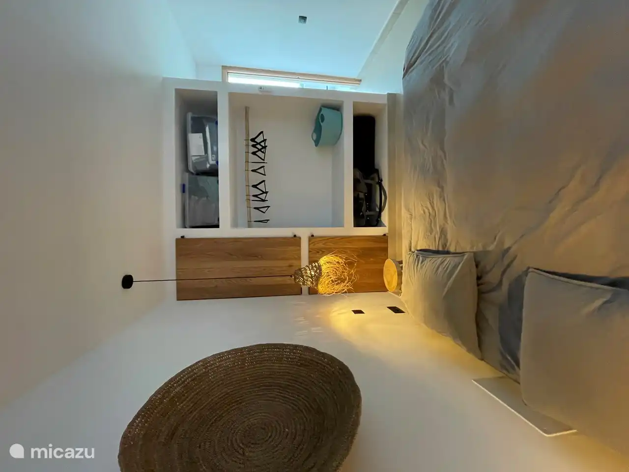 Built-in closet room 2 with wood elements and built-in washing machine and dryer.