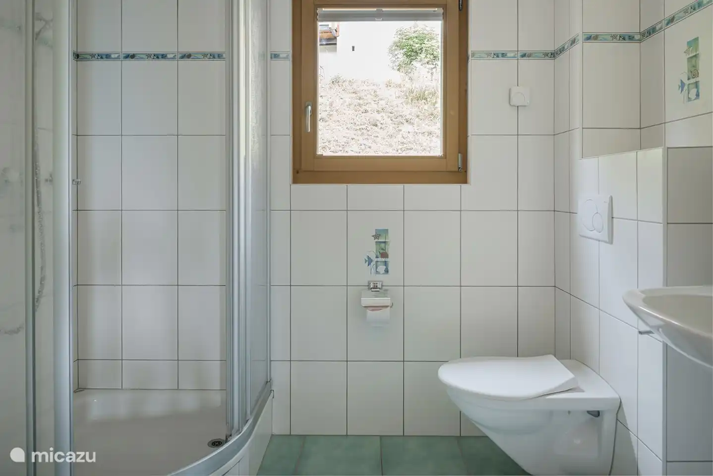 Bathroom with toilet, sink and shower