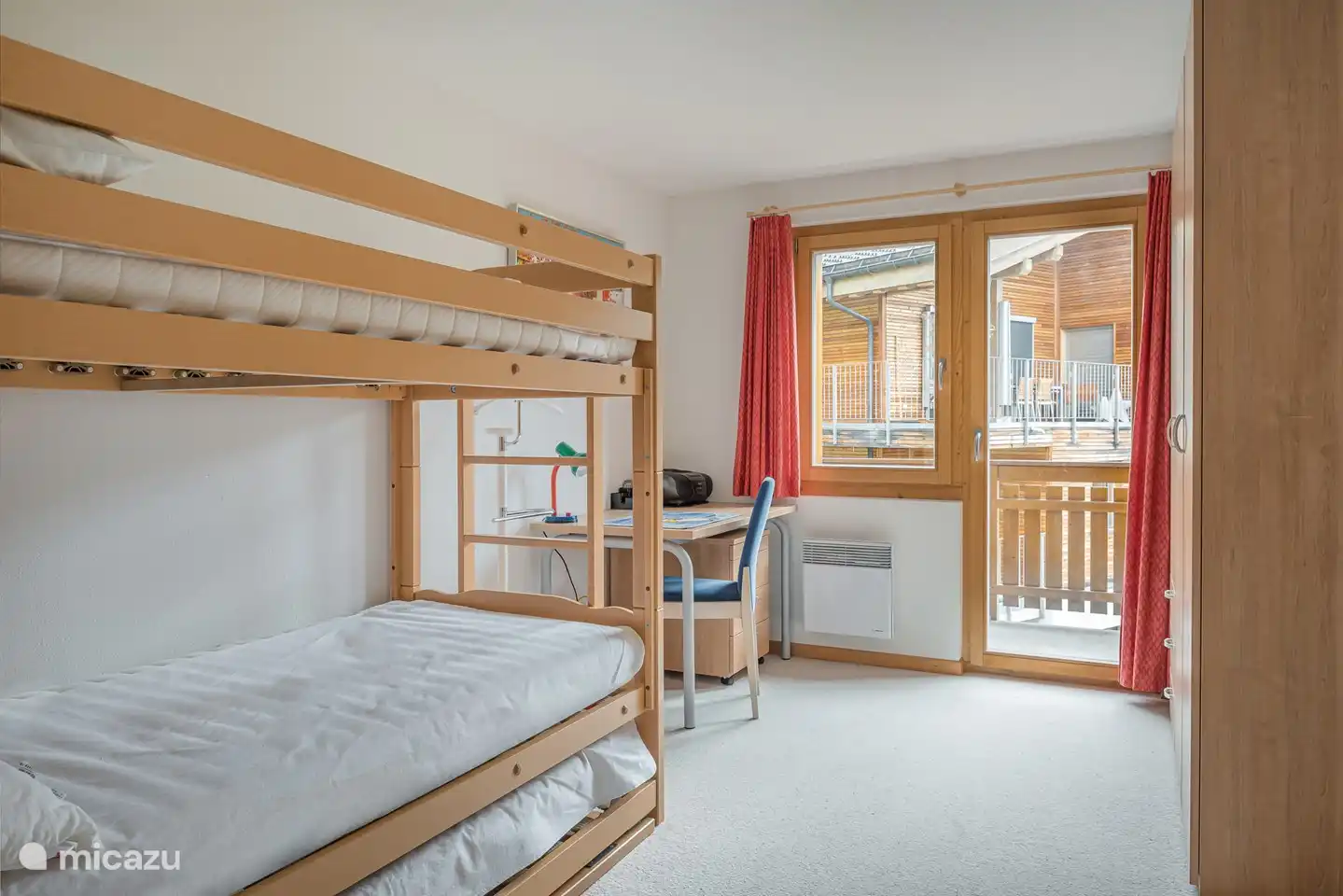Triple room with bunk bed and trundle bed with east-facing balcony and view of the Bettmerhorn.