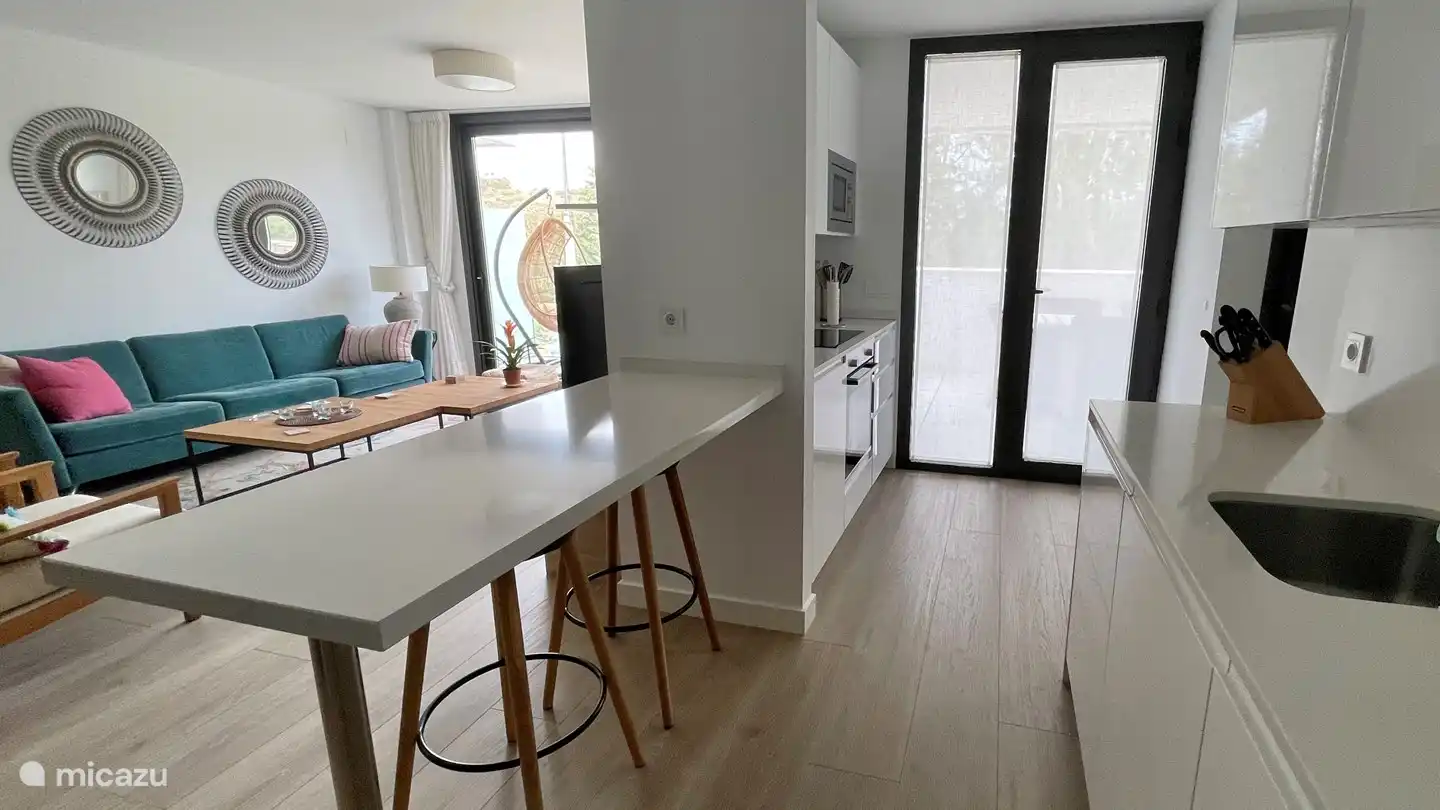 Both from the sitting area and from the kitchen you have access to the terrace at the front of the apartment.