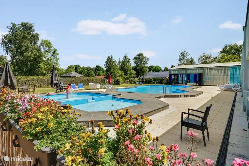 Seasonal outdoor pool with relaxing loungers to get some vitamin D.