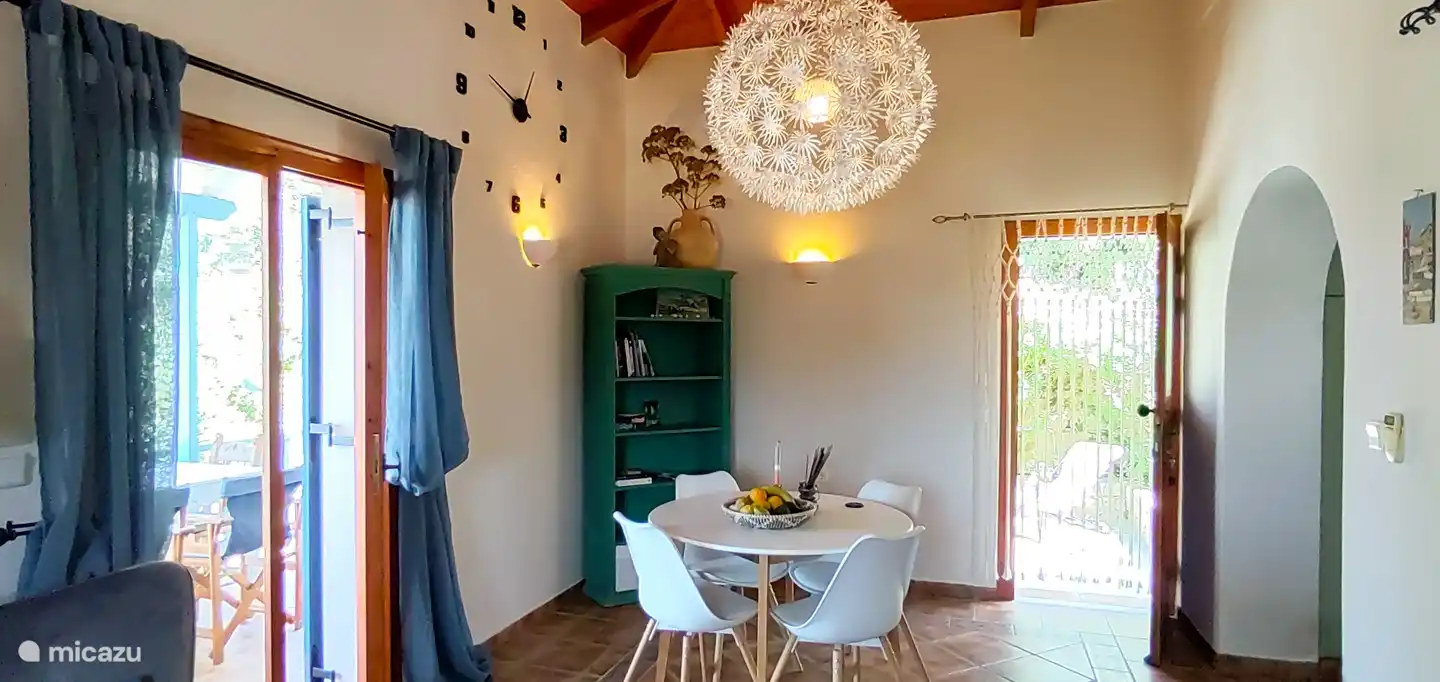 Dining area with cupboard with games and books