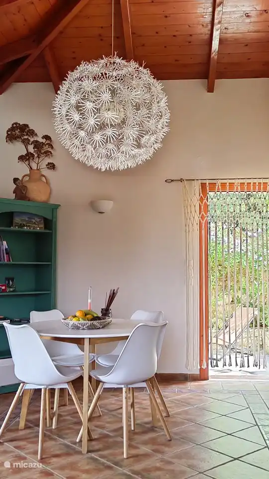 Dining area with cupboard with games and books