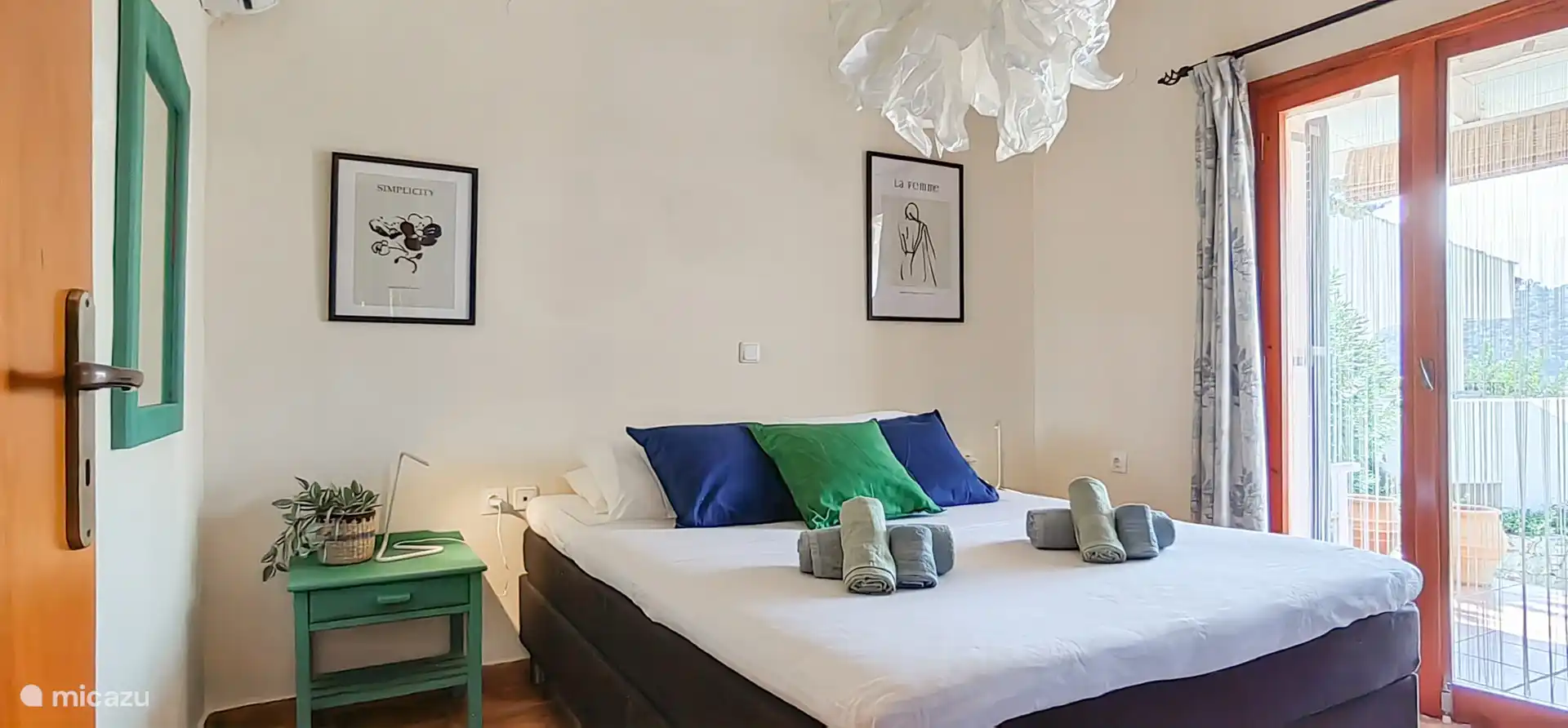 2 person bedroom with box spring and a large wardrobe for all your clothes 