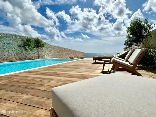 Location de Vacances Bonaire, Bonaire, Sabadeco, villa - Reef Villas Bonaire Soleil, face à l'océan Piscine à débordement en magnésium