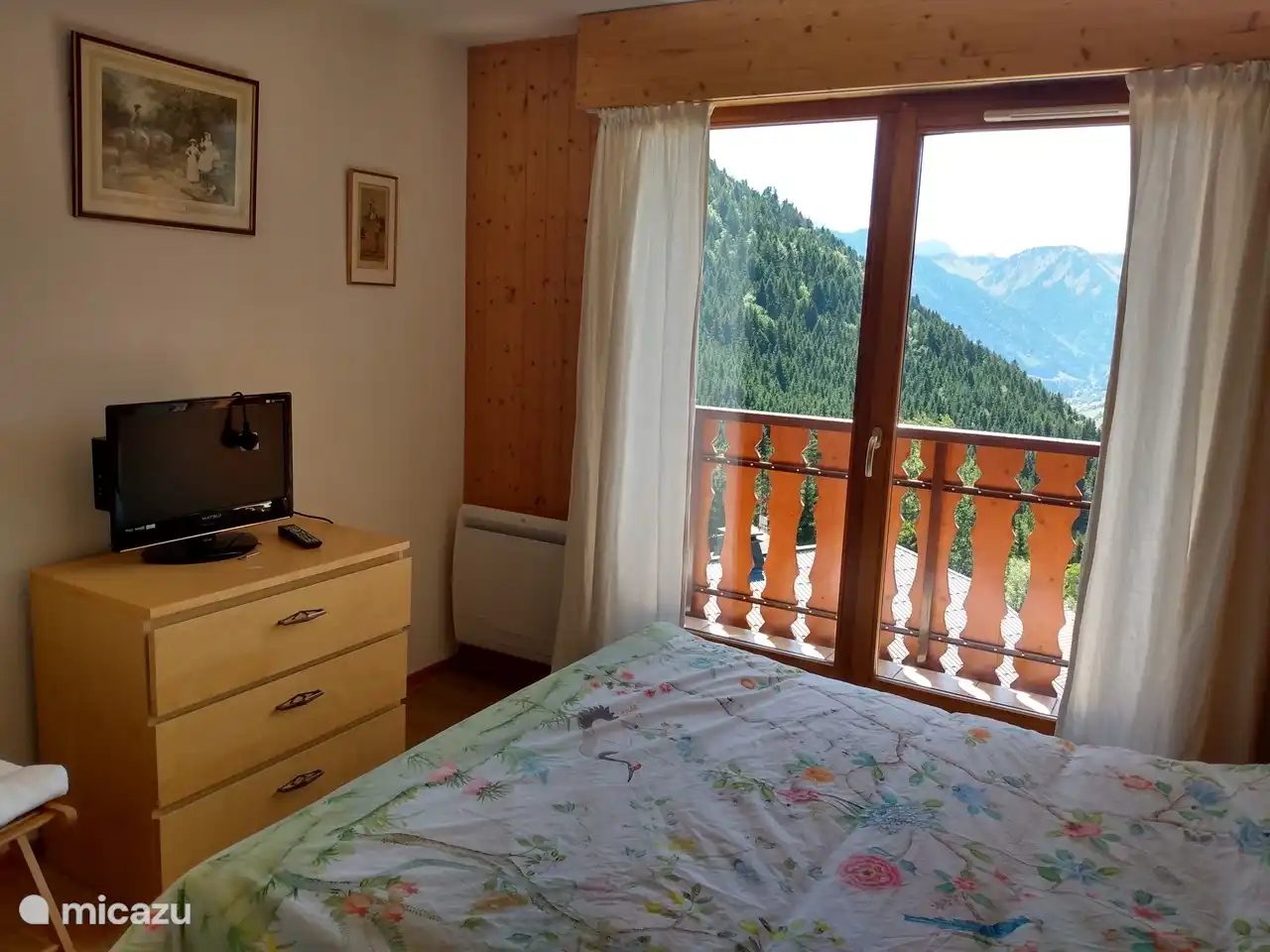 The bedroom has access to the balcony through a large door