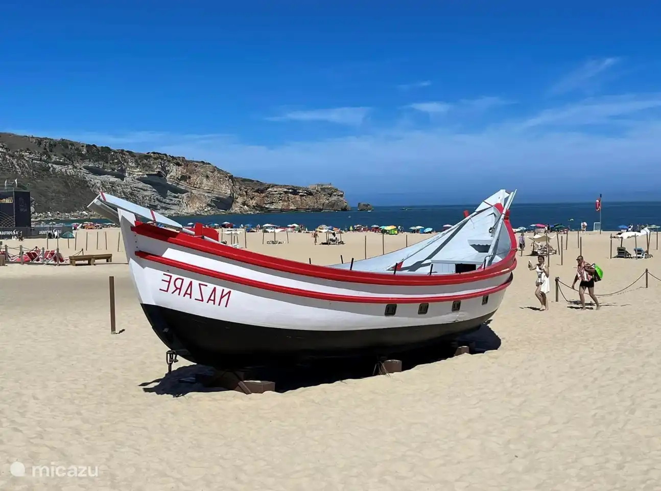 Nazare. Fishing town 
Boulevard with many shops and eateries and the possibility to travel up by train. Sitio beautiful view over the beach.