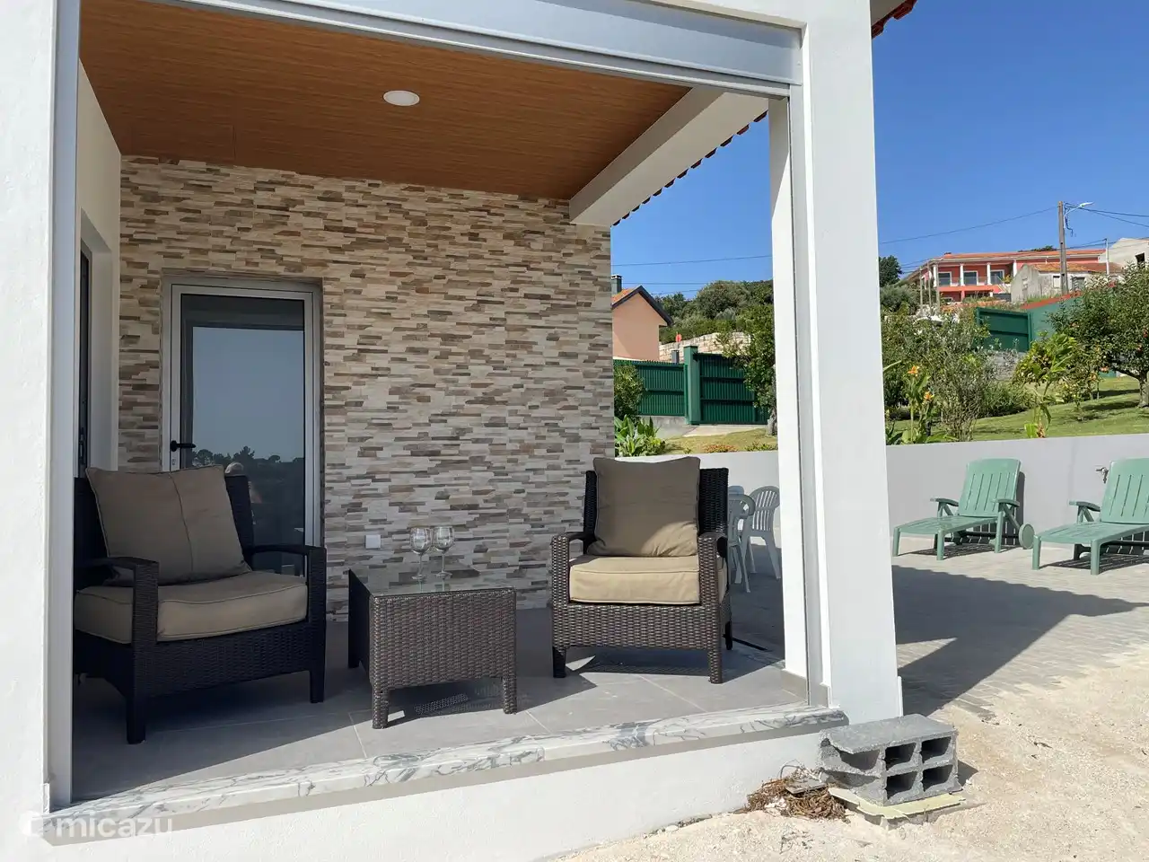 Covered terrace with beautiful views over the valley and adjacent garden