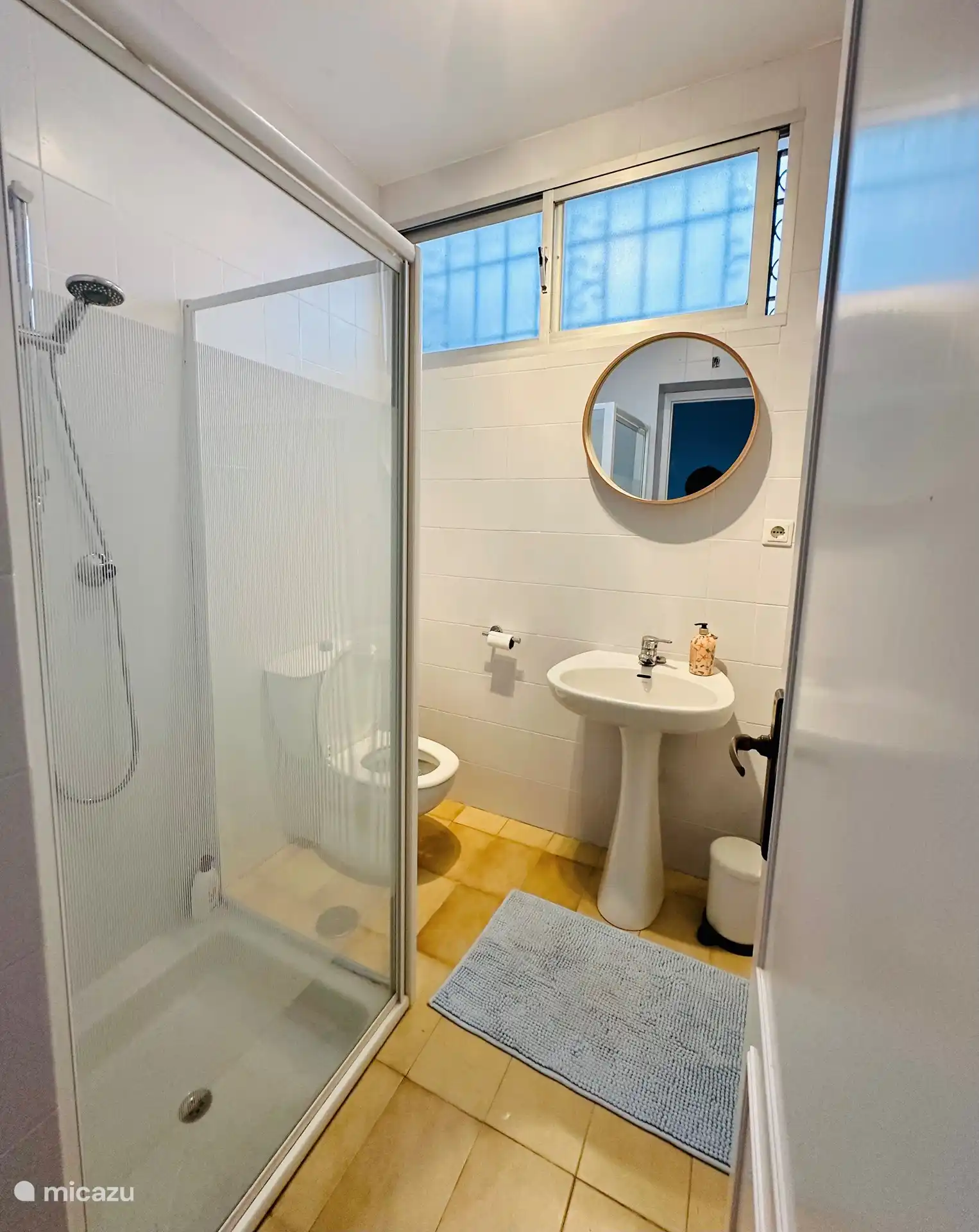 The second bedroom has its own bathroom with shower, sink and toilet.