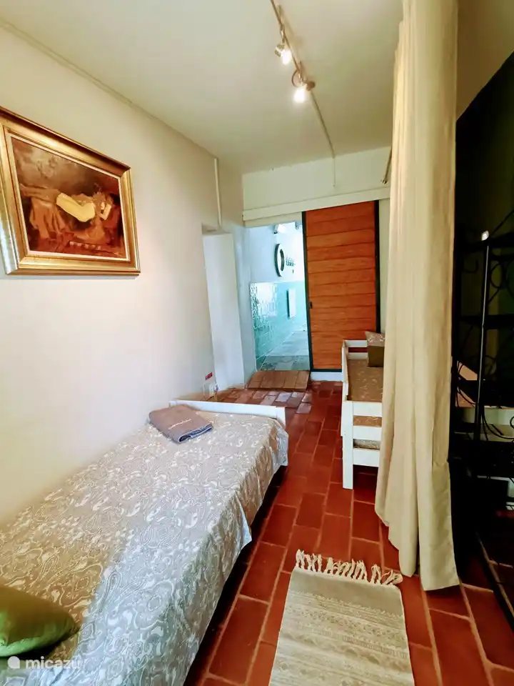 The children's room that connects to the master bedroom and the bathroom.