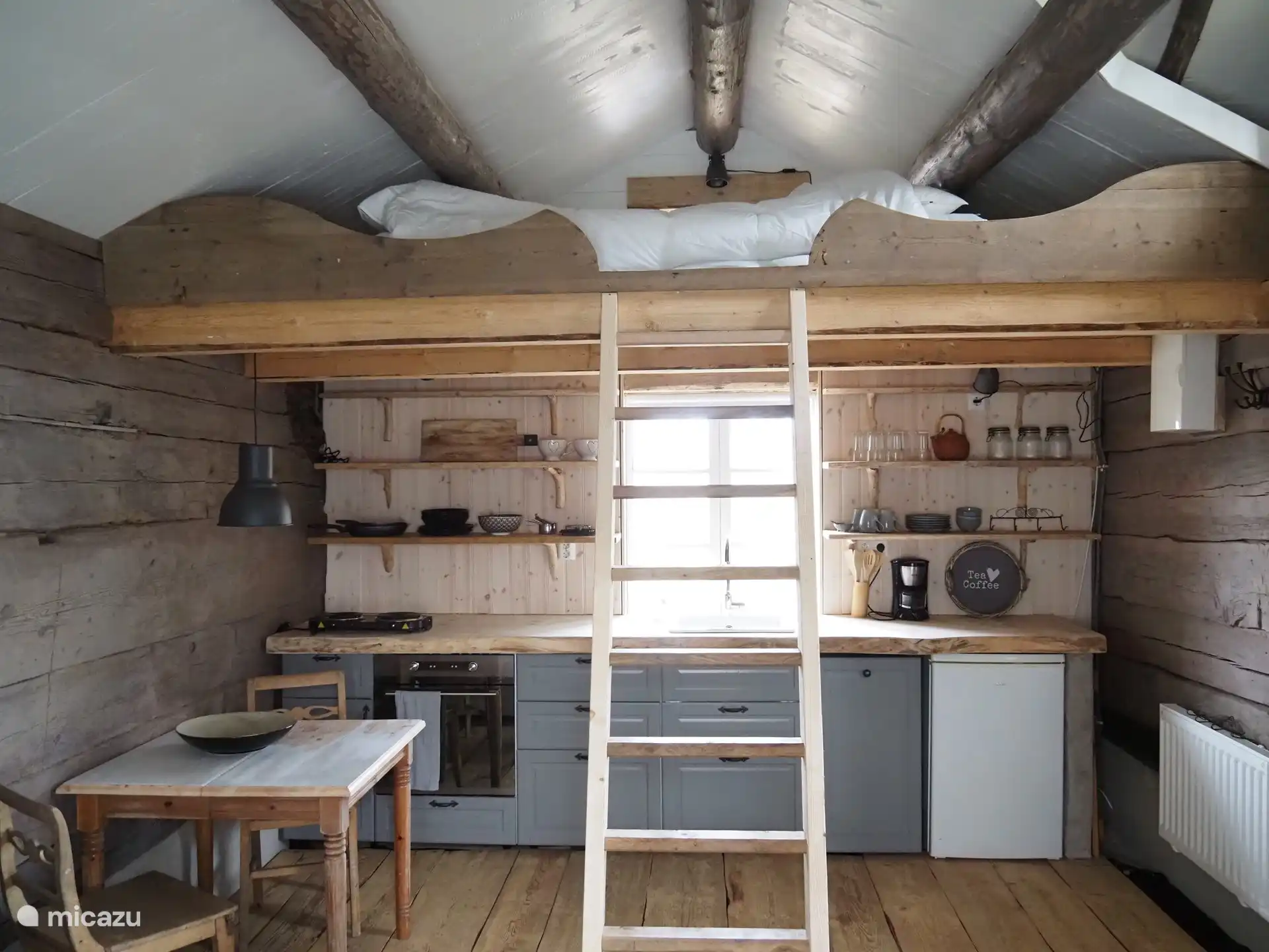 open kitchen with sleeping loft