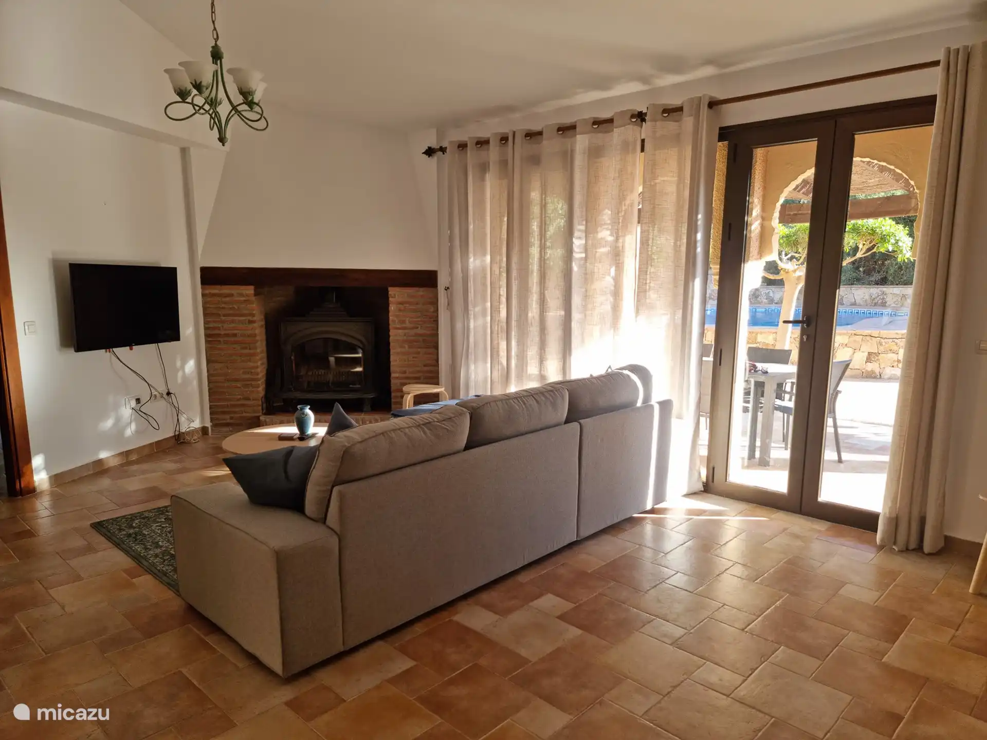 sitting area with TV and fireplace