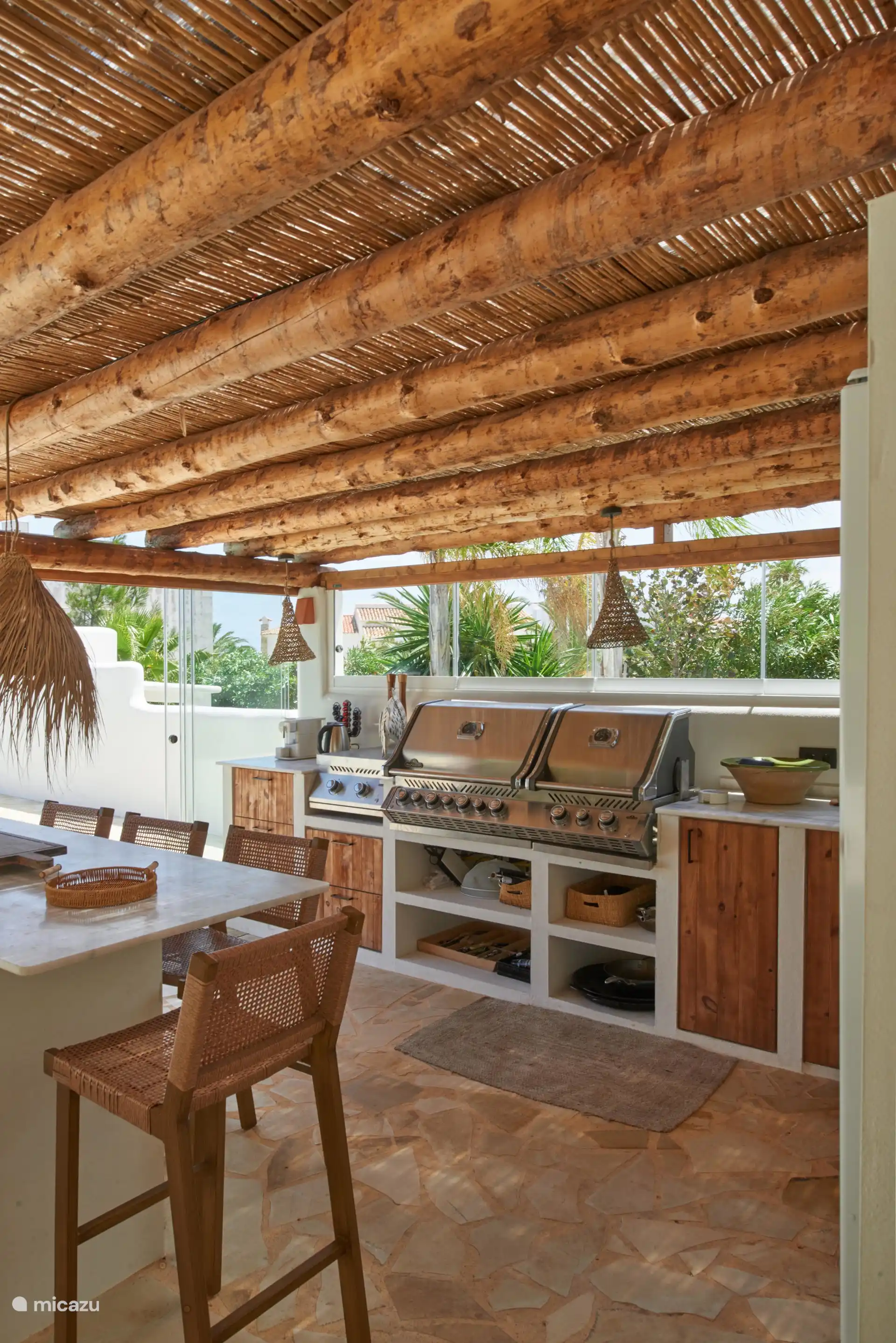 There is a large BBQ area in the outdoor kitchen