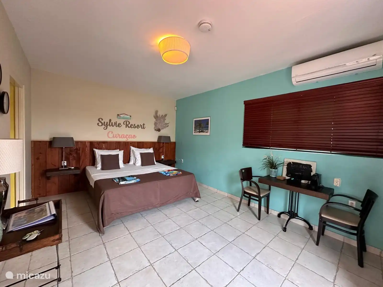 Bedroom with seating and nespresso.