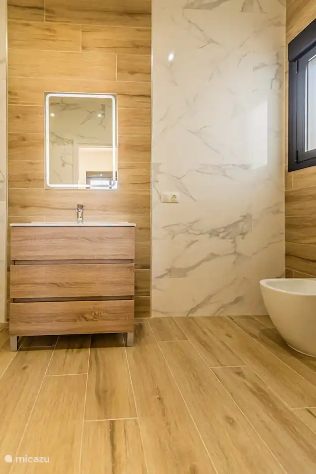 This bathroom belongs to bedroom 1