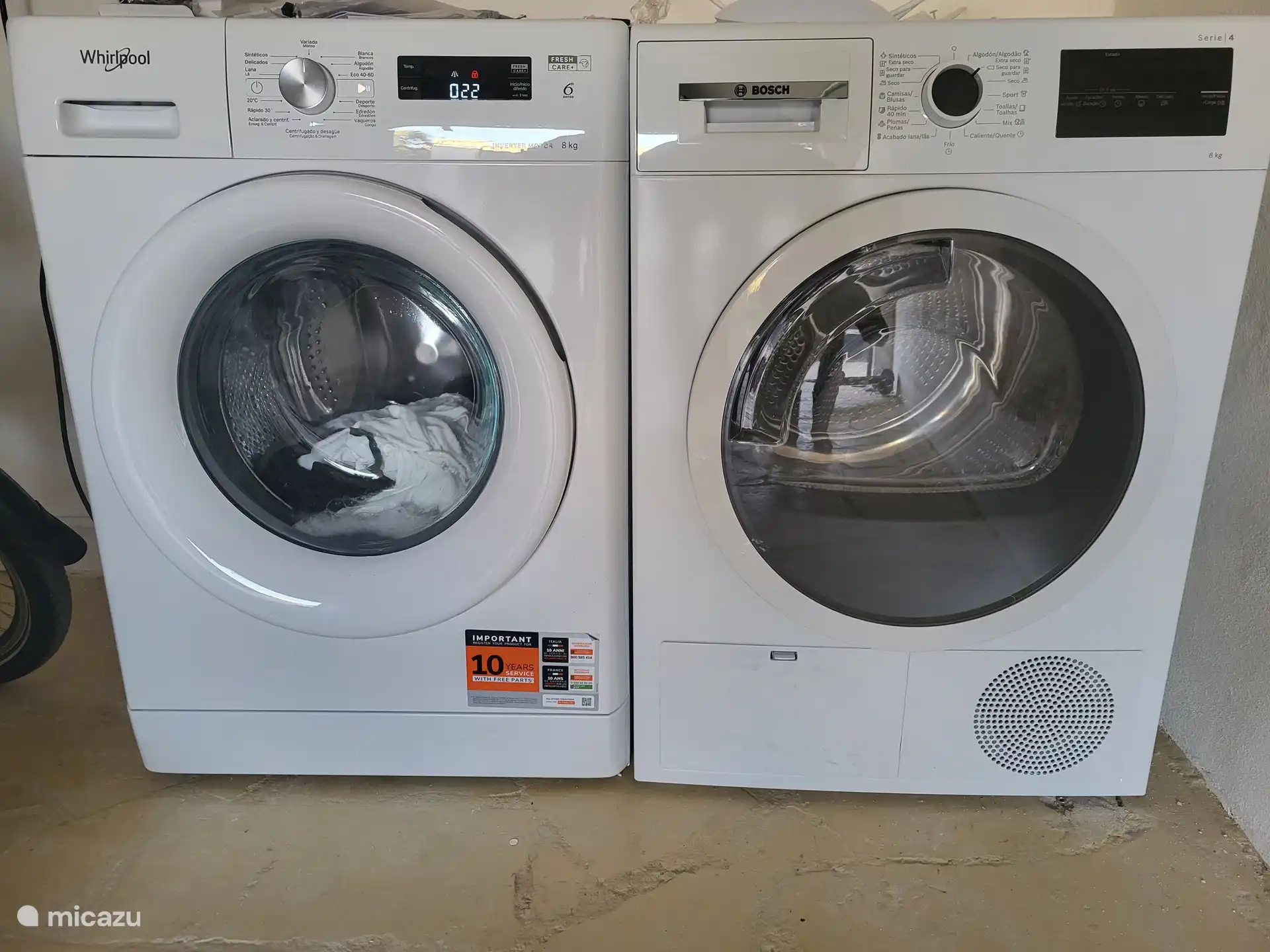 There is a washing machine and a tumble dryer in the basement