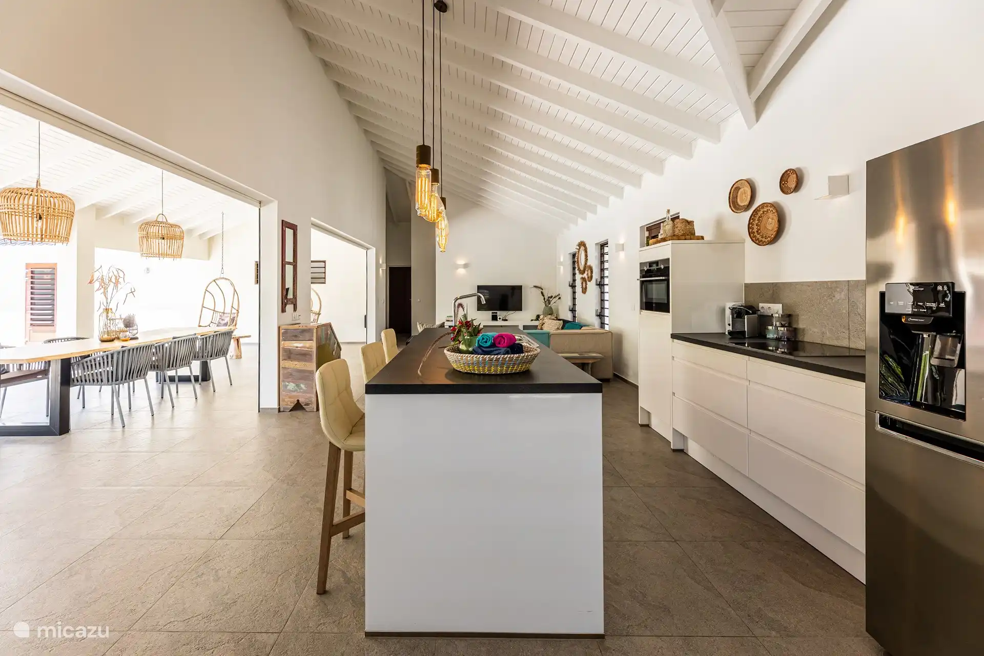Kitchen with American refrigerator with water and ice dispenser