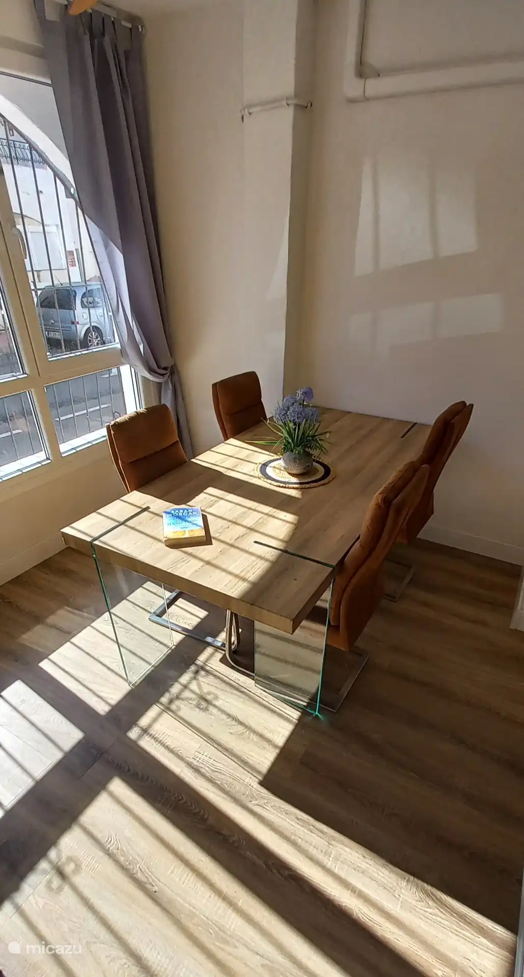 Breakfast room equipped with gas stove, table 4 chairs, and baby chair. There are also 2 folding chairs available.