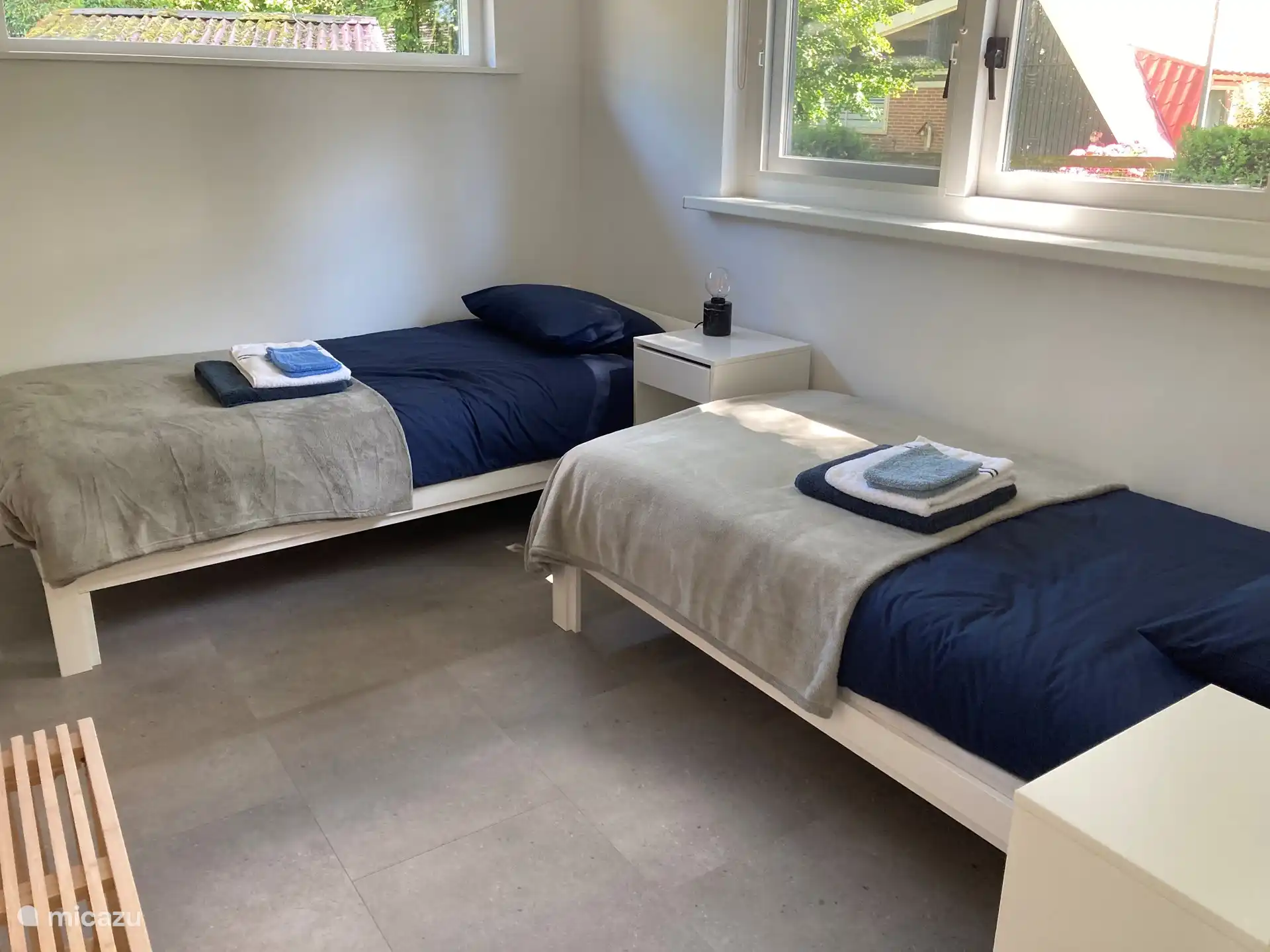 The second bedroom with two single beds