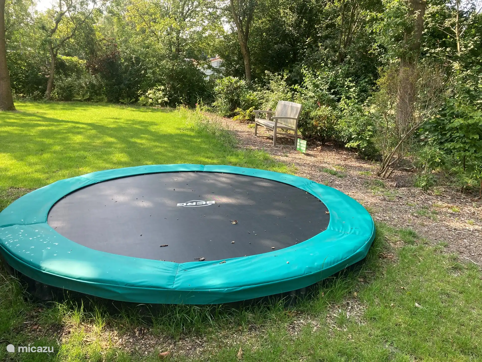 The trampoline at the back of the garden for high jumps