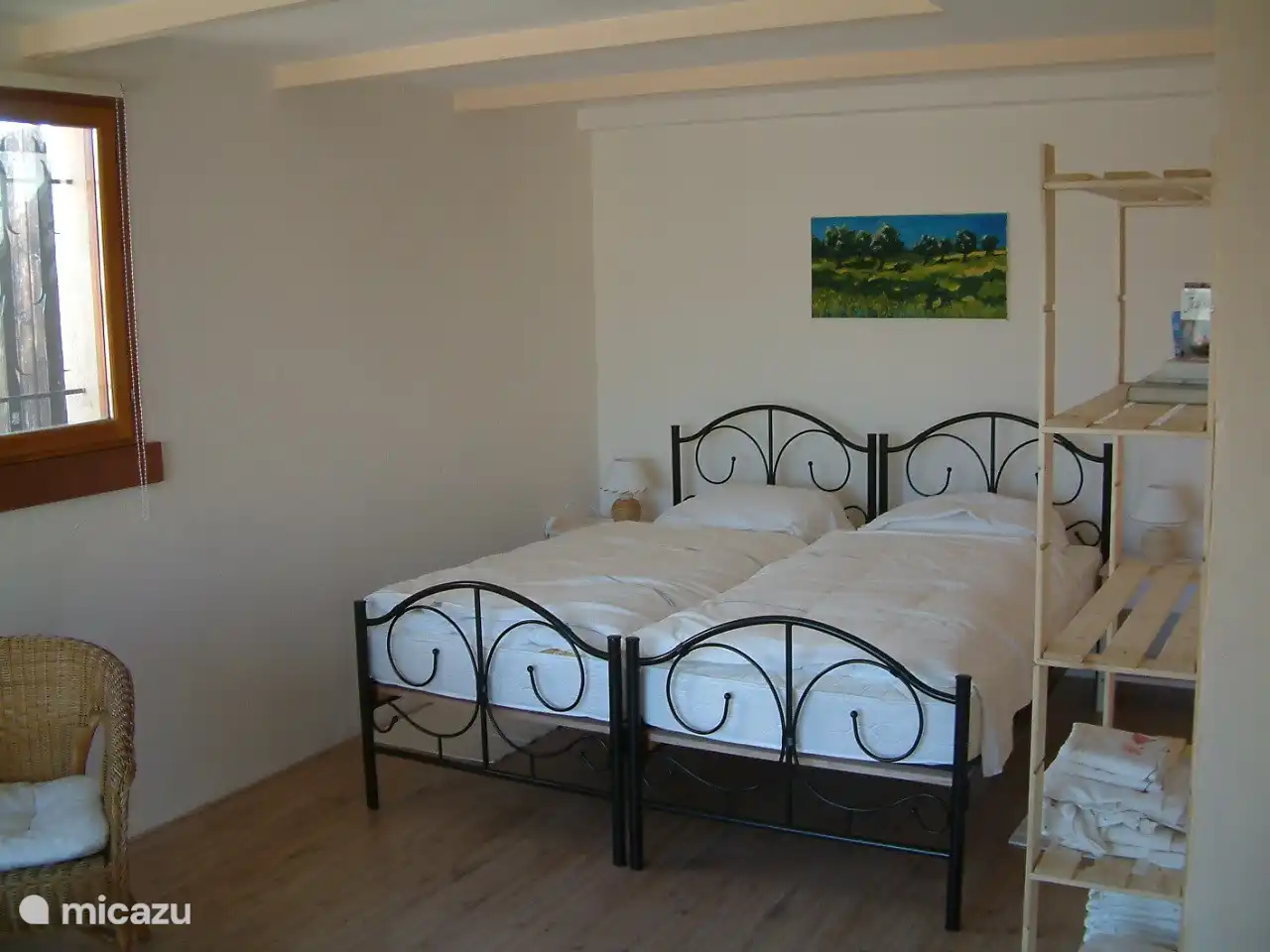 Bedroom 2 with 2 single beds on slatted bases.