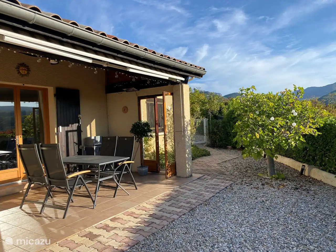 The covered terrace, with plenty of chairs...