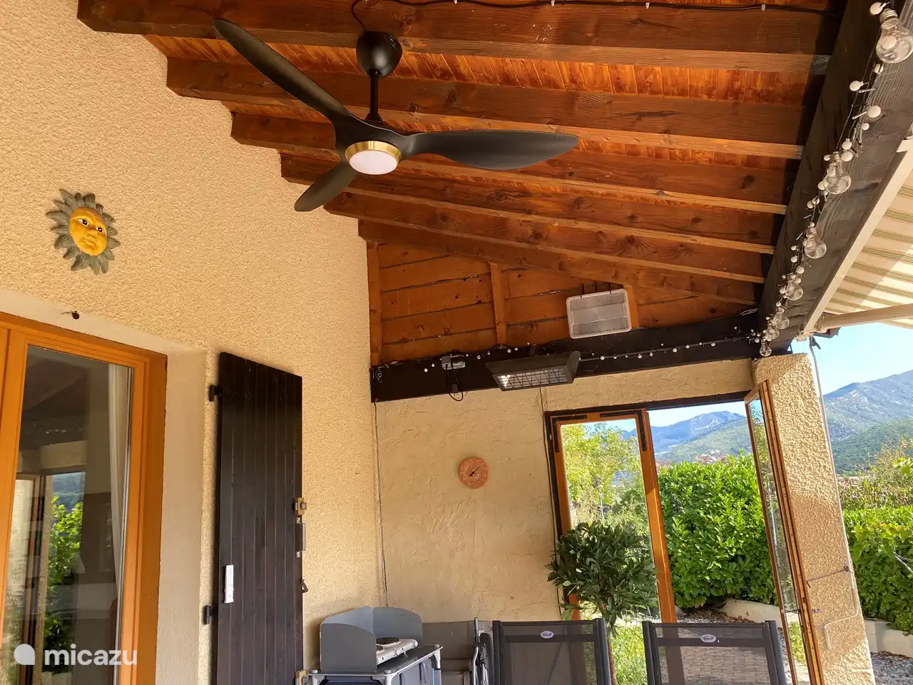 ...a simple outdoor kitchen with electric hob, a CADAC gas barbecue, a patio heater and,,,