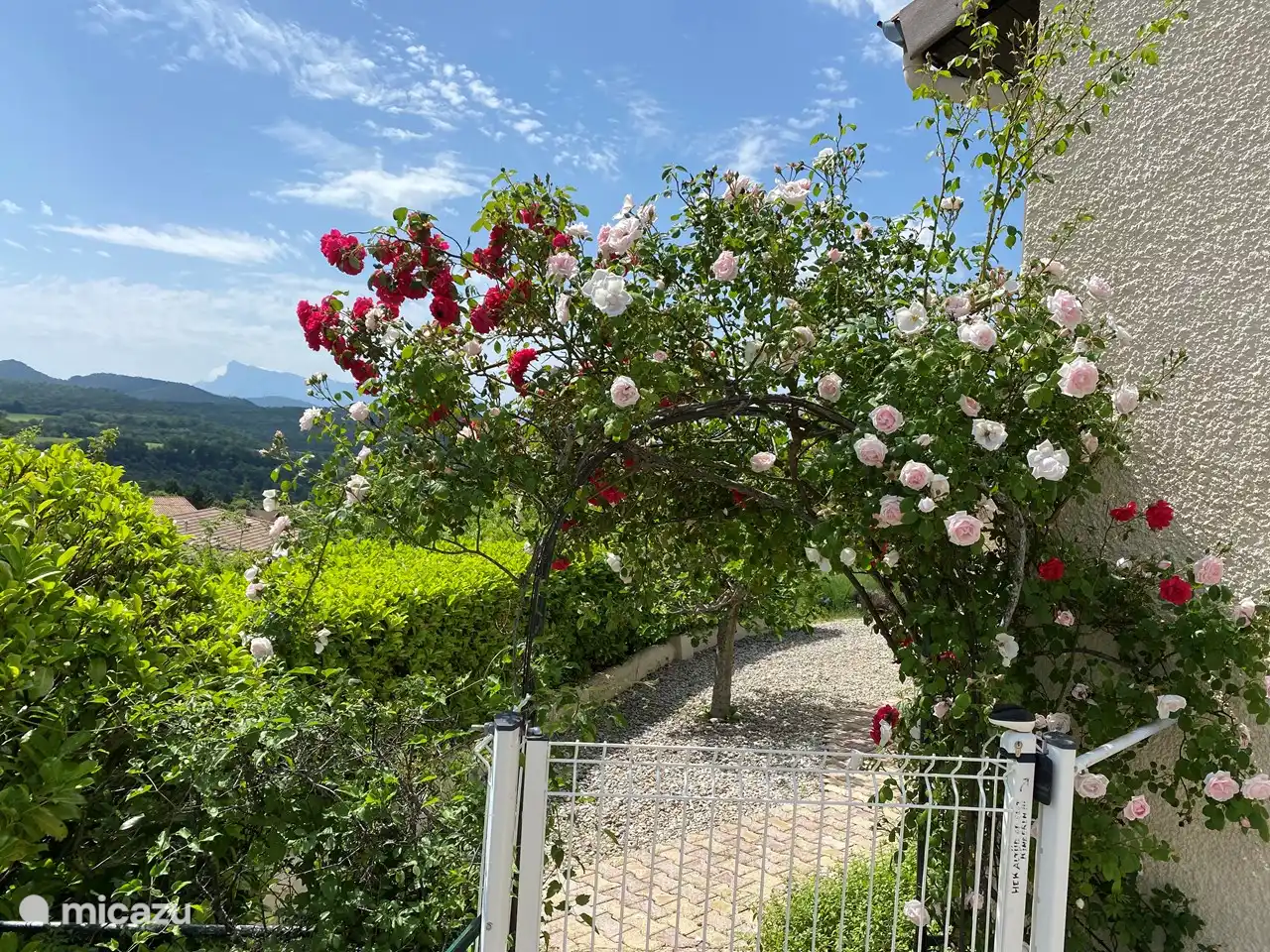 The access between the pool and the house is closed with a gate.