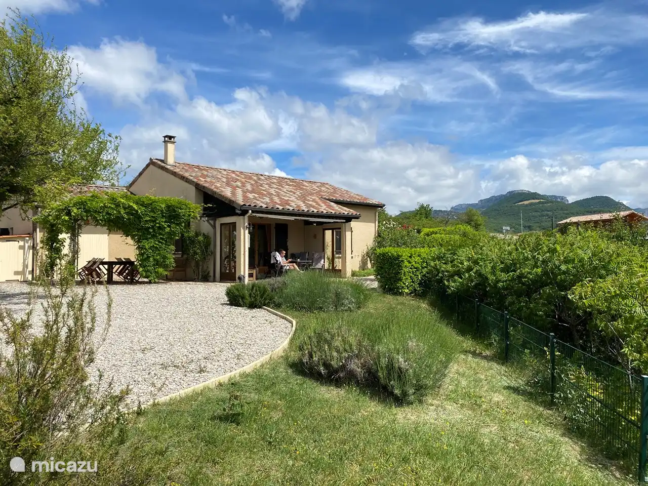 The house with covered terrace overlooks the hills, the village and the 'Trois Becs' massif.
