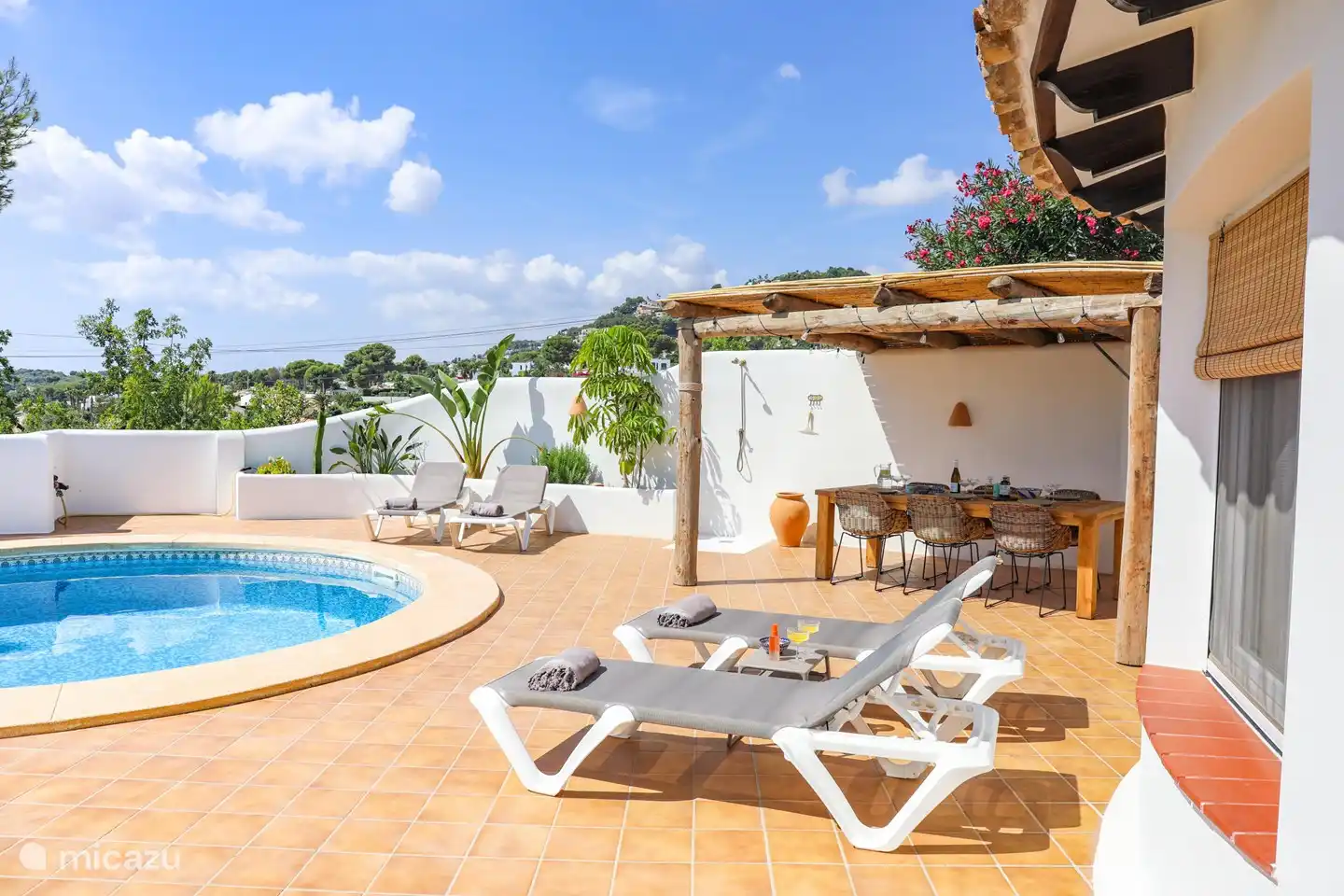 Comfortable sunbeds by the pool