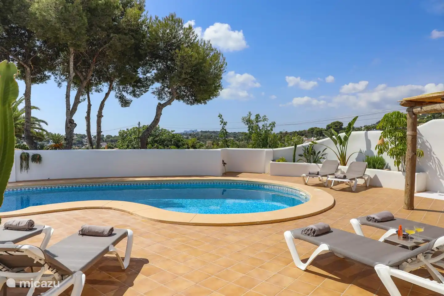 Comfortable sunbeds by the pool