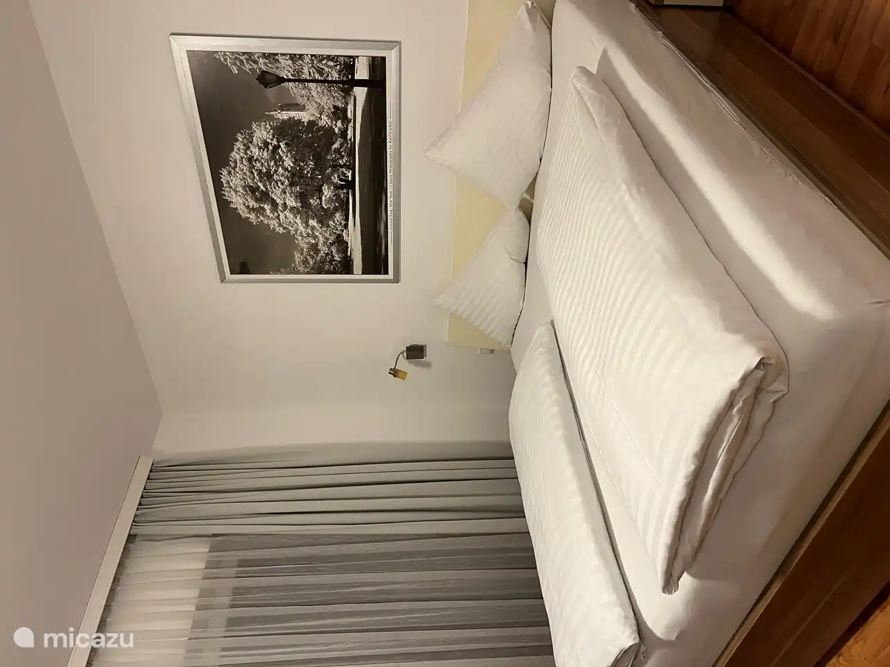 Bedroom with wardrobe and chair.