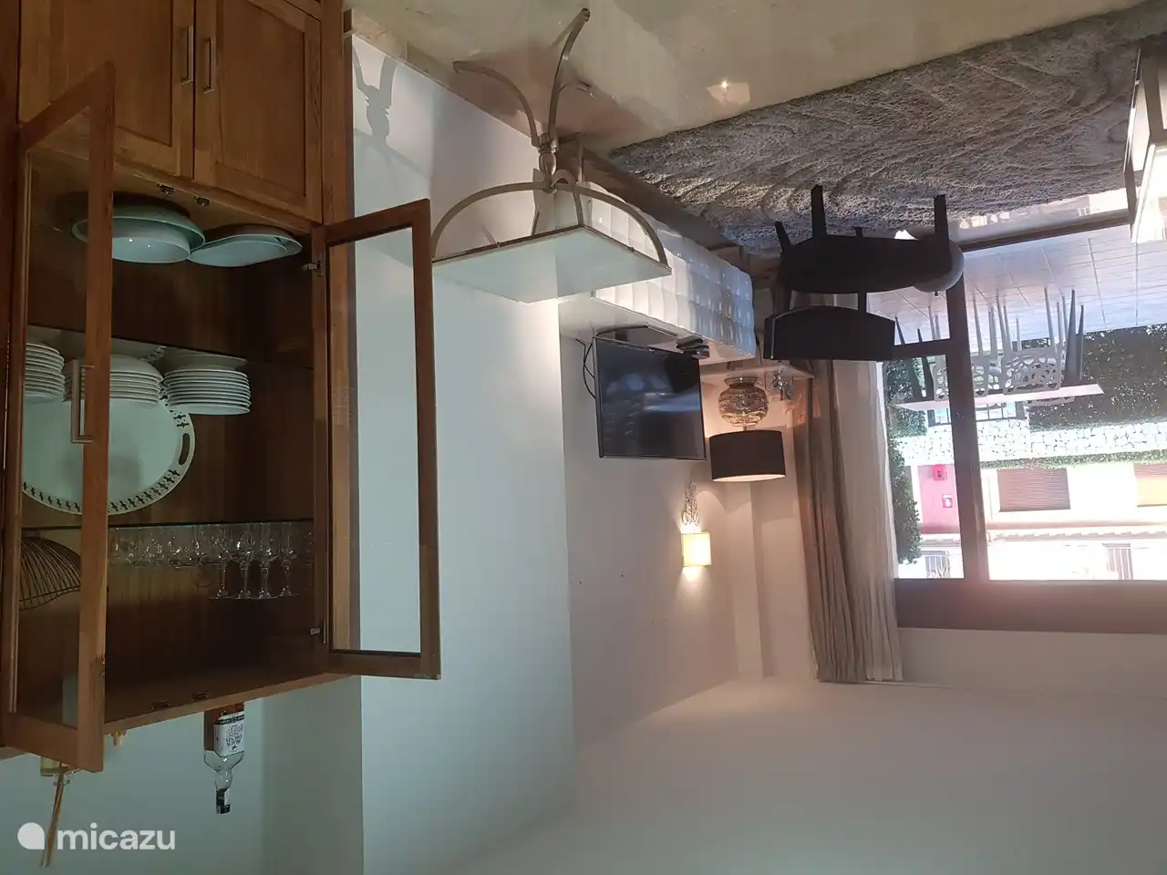 Large bright living room facing the swimming pool.