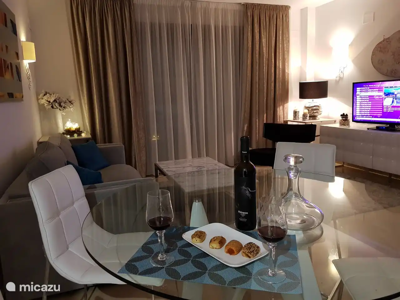 Flat screen TV with all channels and all languages.